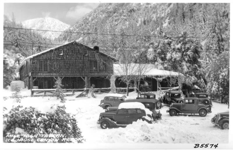 Historic cabin in a wooded mountain canyon